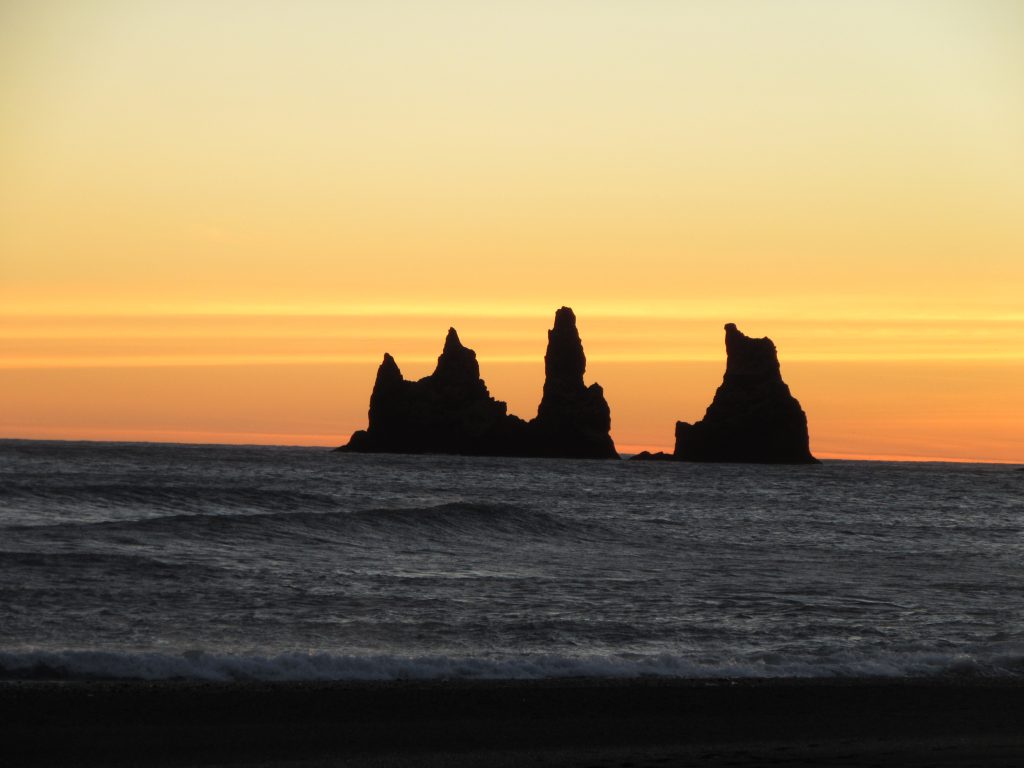 Cliffs in the sea near Vik, Iceland after the sunset