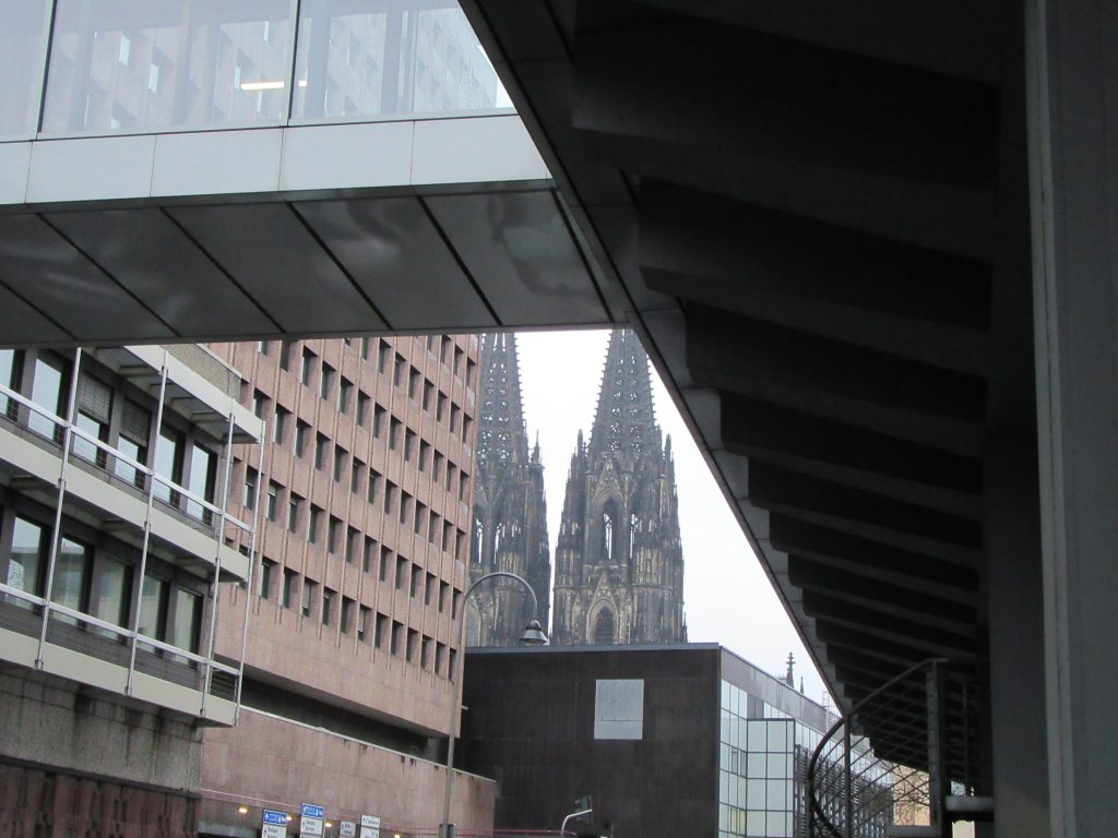 Random shot of modern buildings and Cologne Cathedral in between