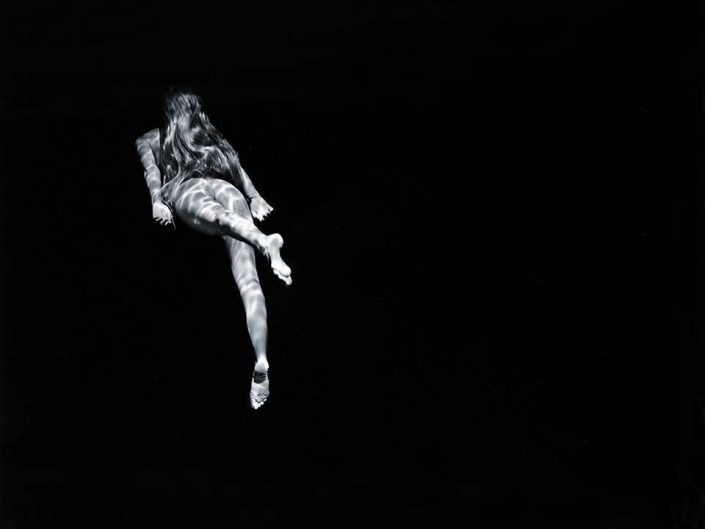 Michael Dweck photography of underwater swimming naked girl, mermaid