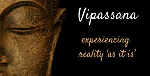 poster that has half of buddha's face and a text: Vipassana experiencing reality as it is