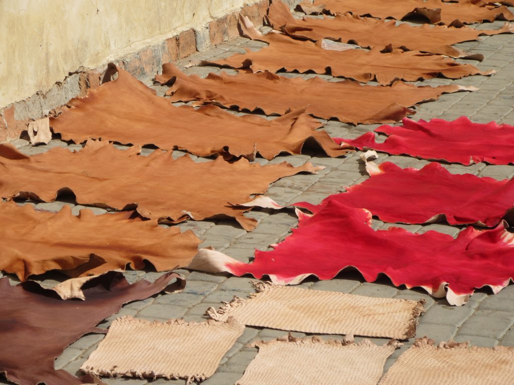 colorful leather hides drying on the floor of Marrakesh