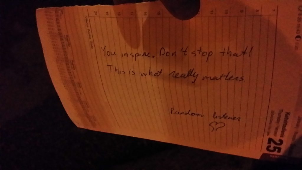 Text on a paper in the dark reads: you inspire. don't stop that. This is what really matters. Random listener. Heart sign.